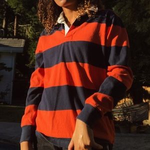 orange and navy blue rugby shirt collared